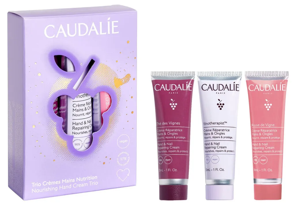 La caja morada y los tres productos del set Caudalie Christmas 2024 The Nourishing Hand Cream Trio