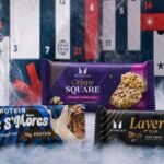 Detalle de la caja y algunos de los productos del Calendario de adviento Myprotein 2026